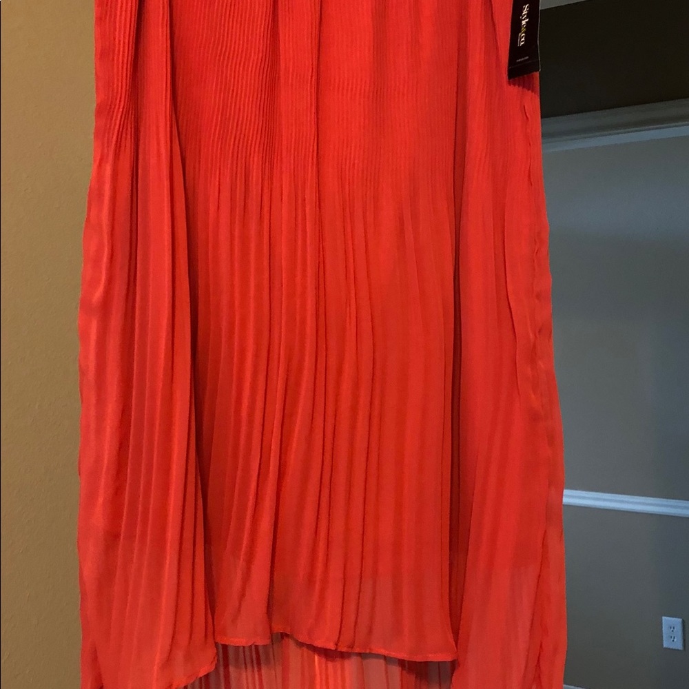 Sheer flowy tangerine colored skirt